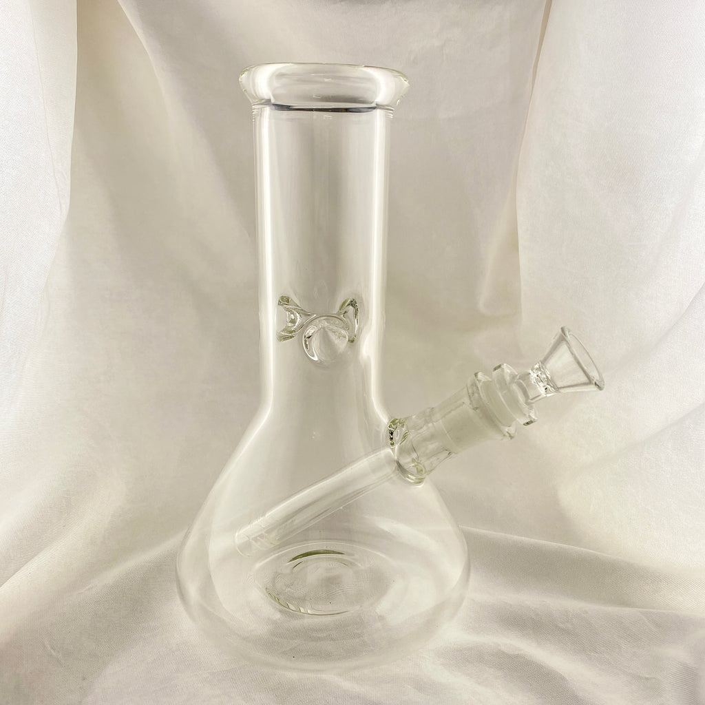 Clear glass bong on a white fabric background