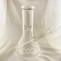 Clear glass bong on a white fabric background