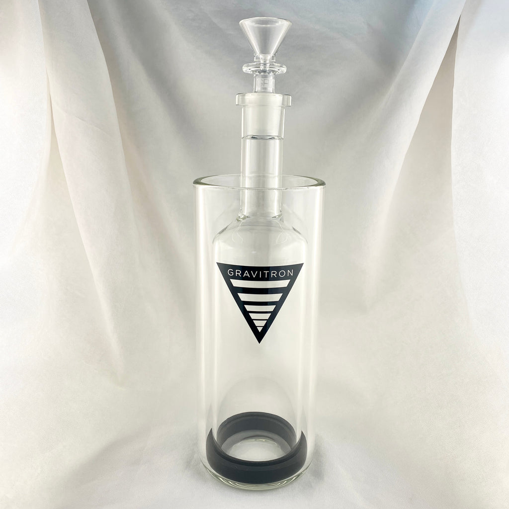 Clear glass bottle with a black logo on a white background