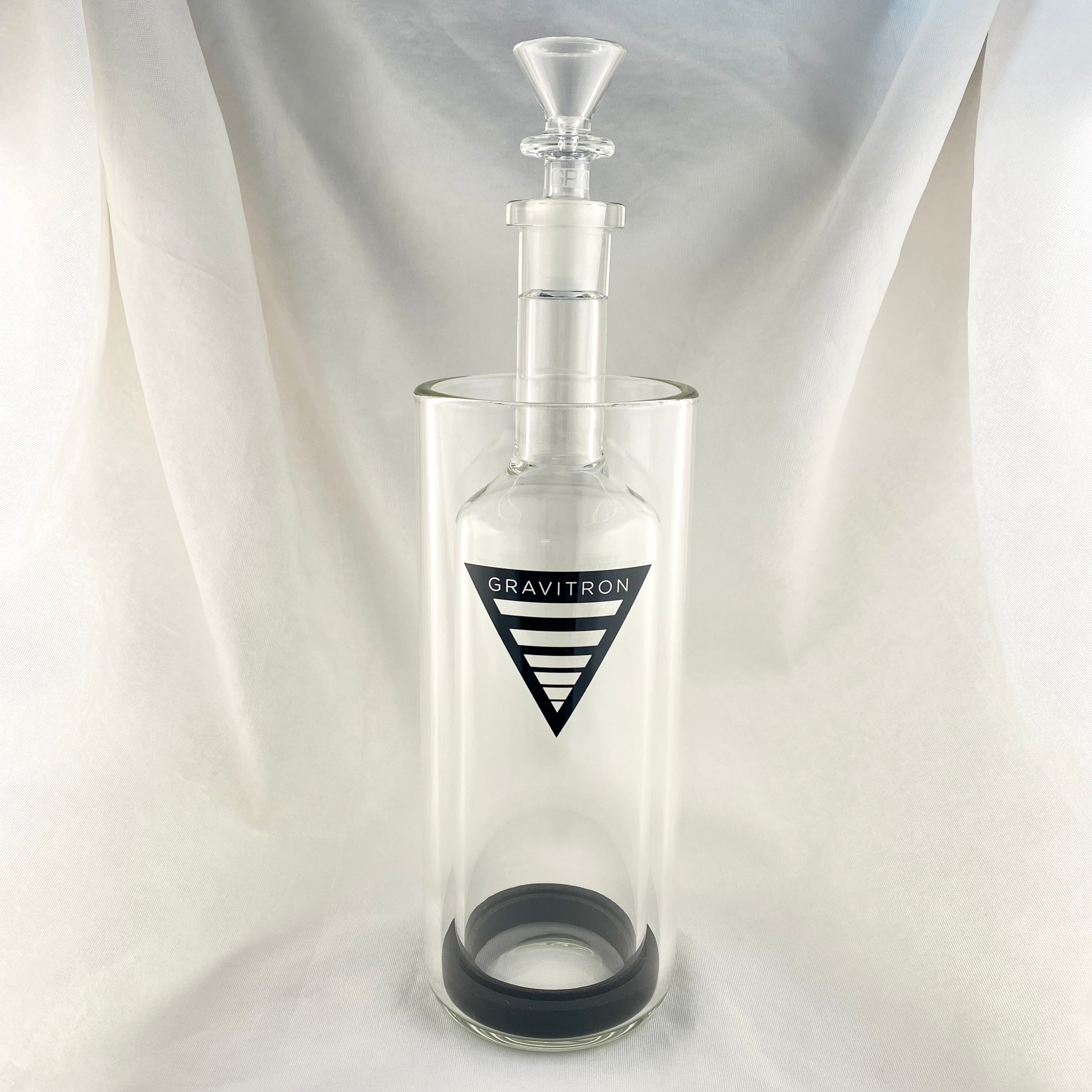 Clear glass bottle with a black logo on a white background