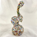 Multicolored glass smoking device on a white background