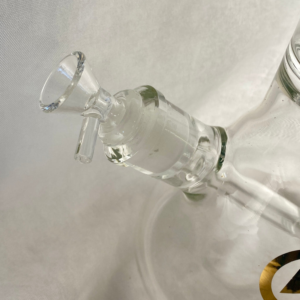 Close-up of a glass water pipe on a light gray background