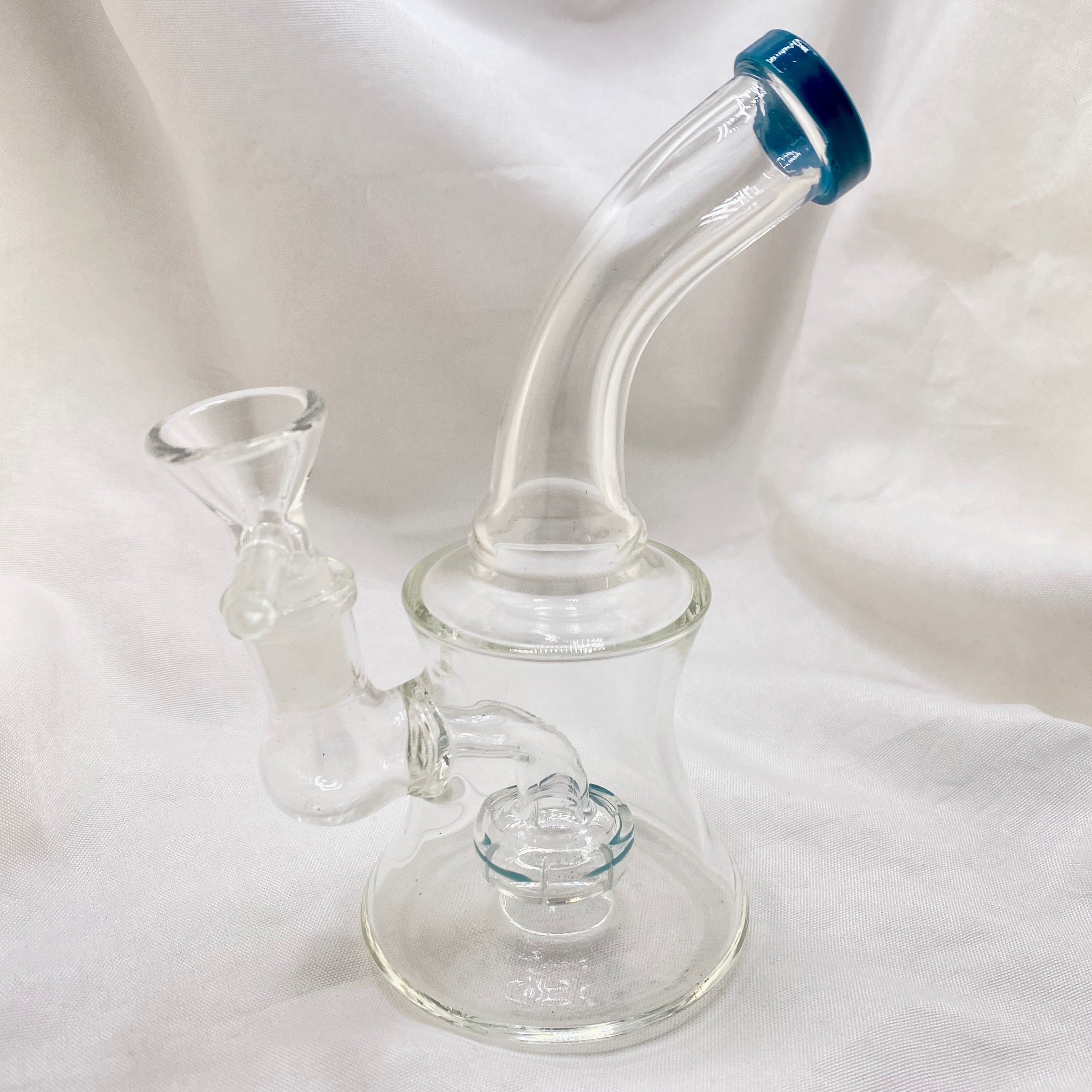 Clear glass water pipe with blue accent on a white background