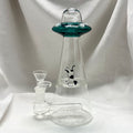 Clear glass smoking apparatus with a green top on a white background