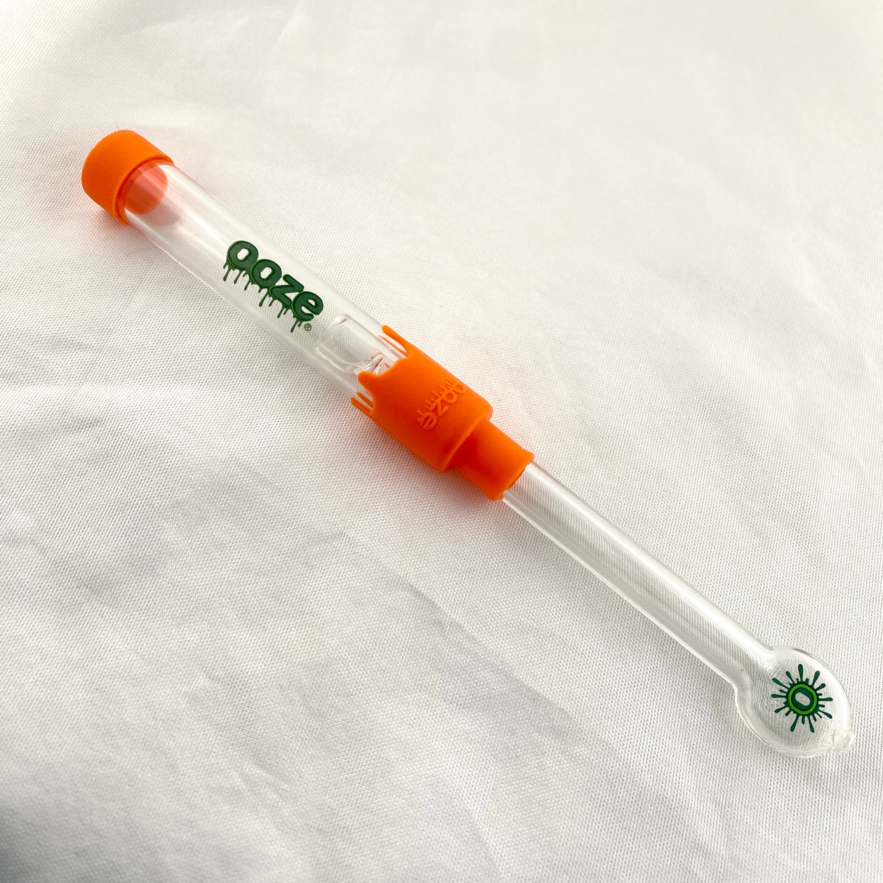 Clear tool with orange accents and 'ooze' branding on a white background