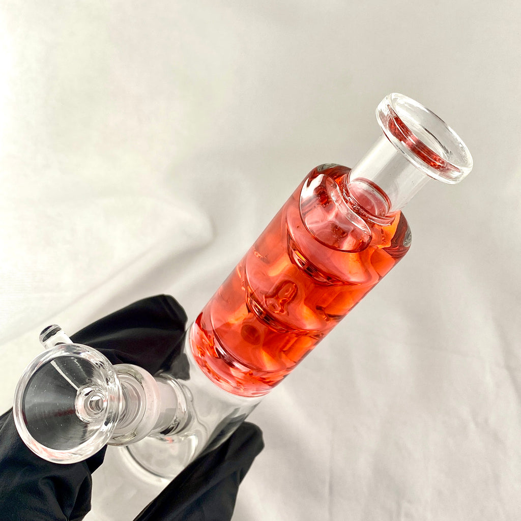 Wine bottle with a glass stopper on a white background