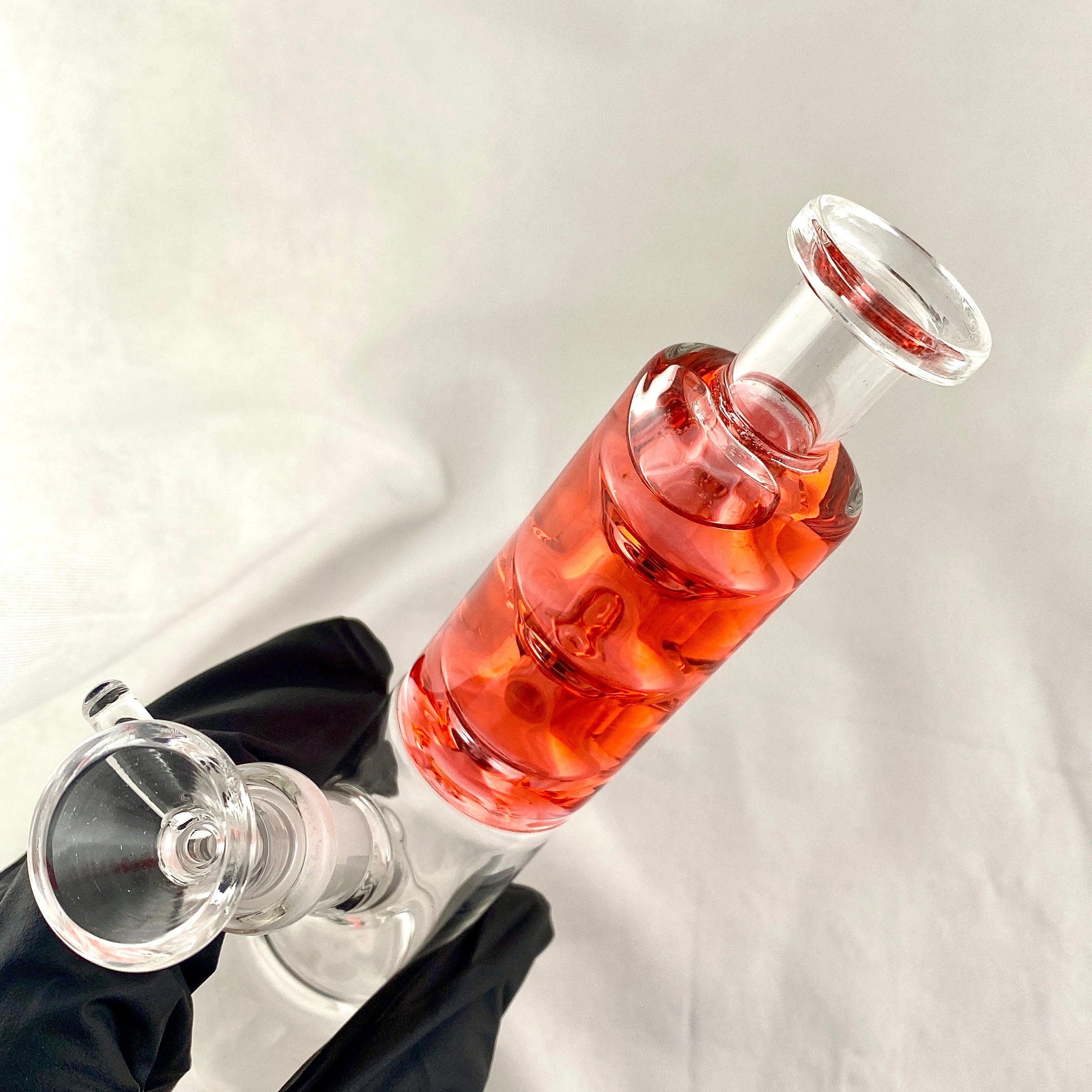 Wine bottle with a glass stopper on a white background