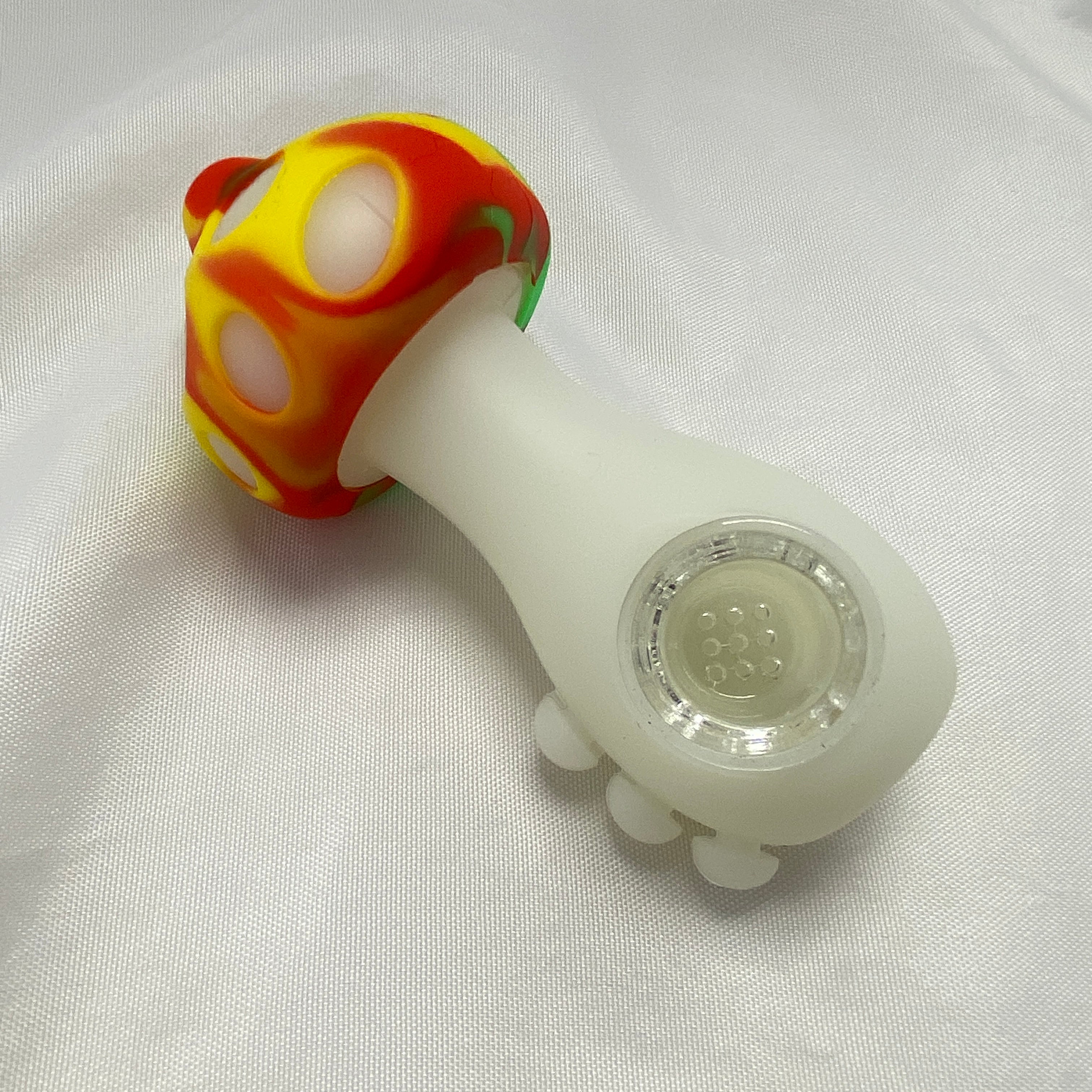 Glass pipe with colorful mushroom-shaped top on a white background